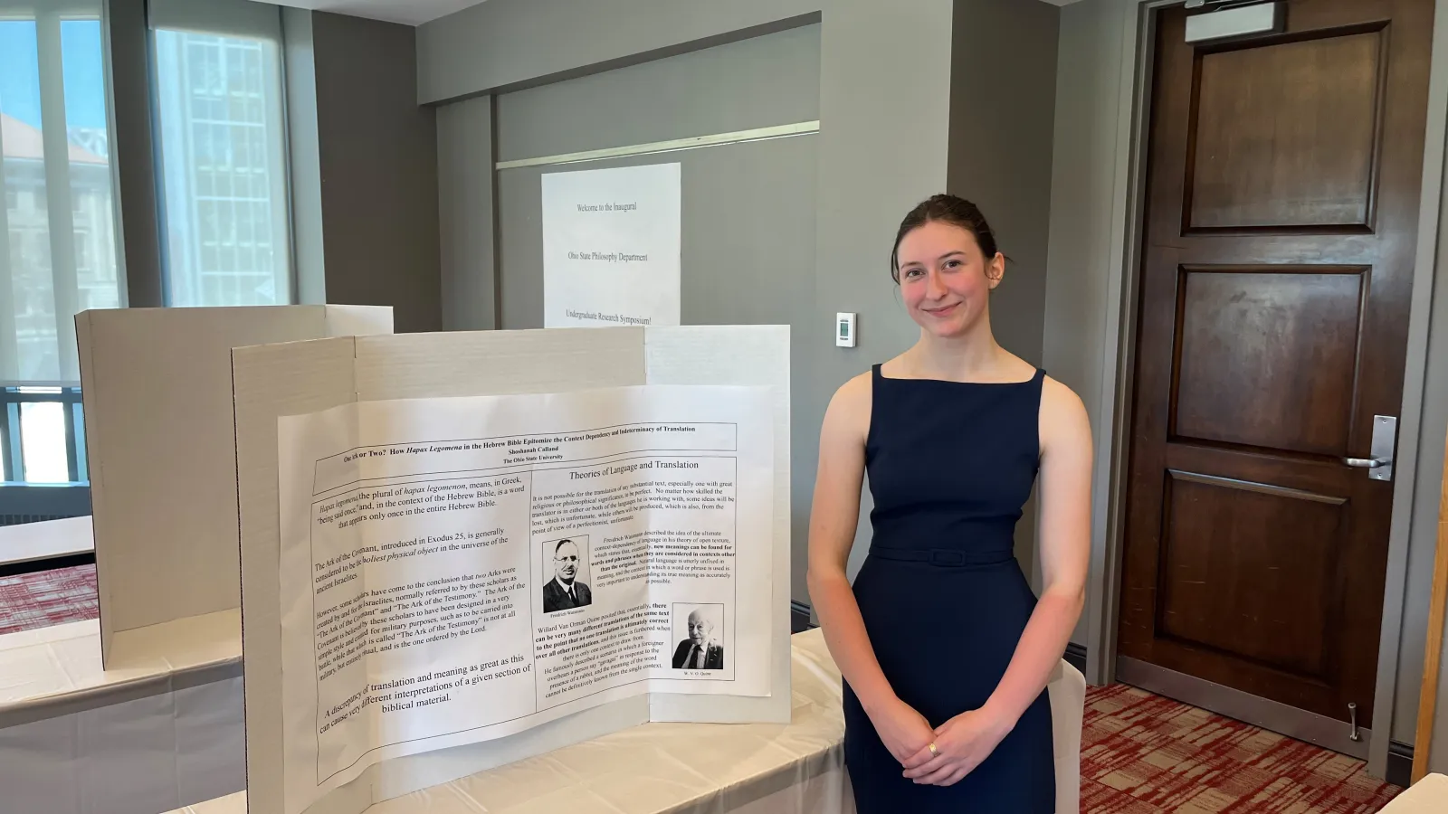 Shoshanah Calland in front of her display table. 