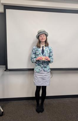 Tabitha Skelding holding her medal. 