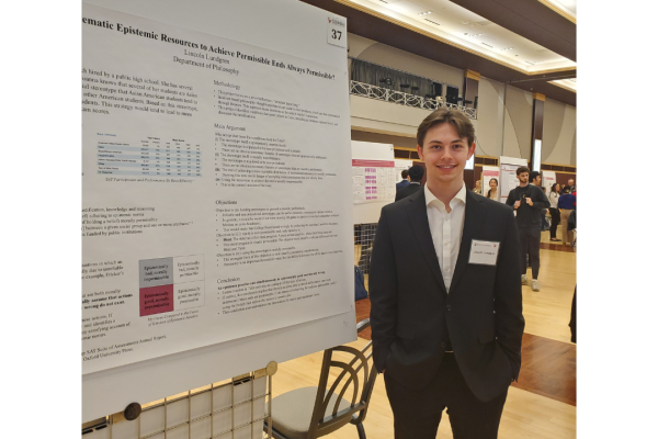 Lincoln Lundgren standing next to his display.